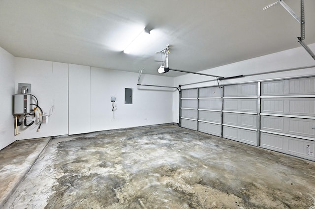 garage with a garage door opener and electric panel