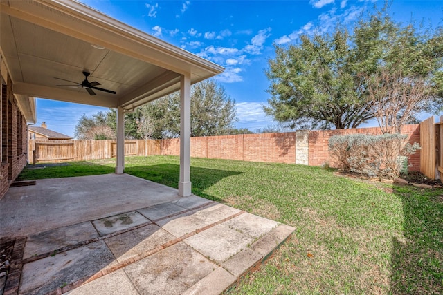 view of yard featuring a ceiling fan, a patio, and a fenced backyard