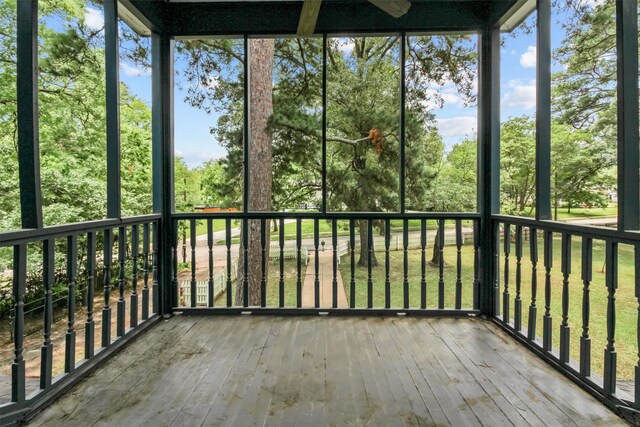 unfurnished sunroom featuring a wealth of natural light