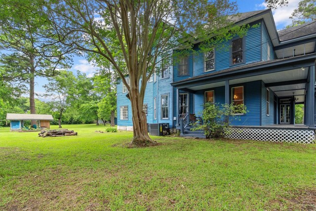 view of yard with covered porch