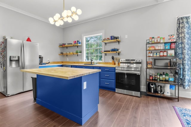 kitchen featuring blue cabinets, open shelves, butcher block countertops, and appliances with stainless steel finishes