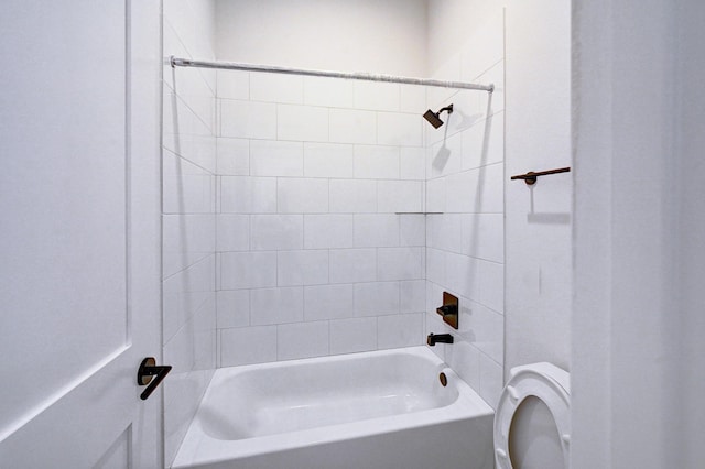 bathroom with shower / bathing tub combination and toilet