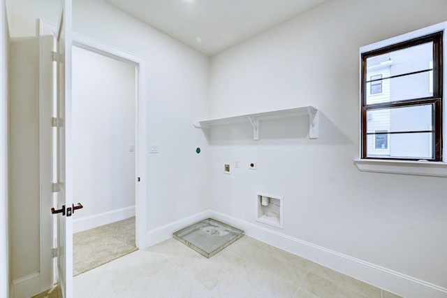 laundry room with hookup for an electric dryer, washer hookup, gas dryer hookup, baseboards, and laundry area