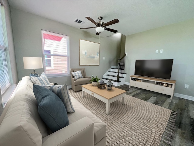 511 Caisson St, Surfside Beach, TX 77541 - living room featuring wood finished floors, baseboards, ceiling fan, and stairs