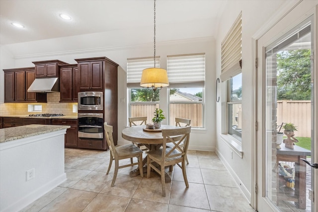 dining area featuring recessed lighting, baseboards, plenty of natural light, and light tile patterned floors