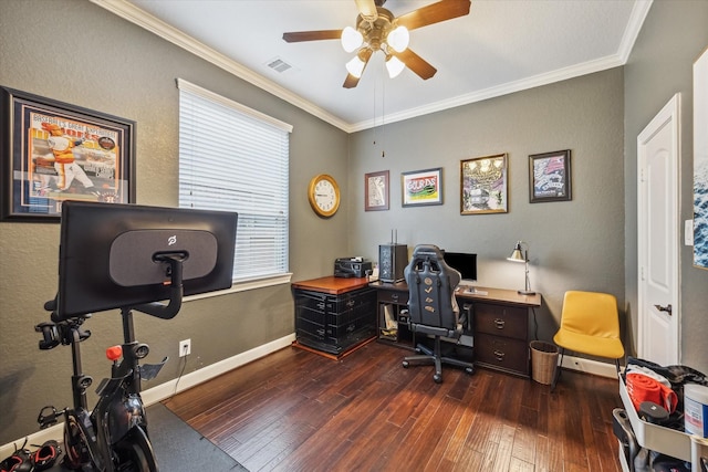 home office featuring visible vents, a ceiling fan, dark wood-type flooring, and ornamental molding