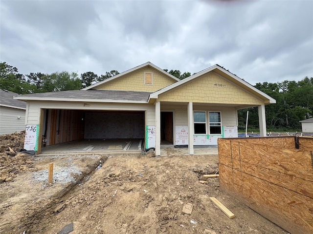 756 Westpointe Dr, Dayton, TX 77535 - unfinished property featuring a garage, a porch, and driveway