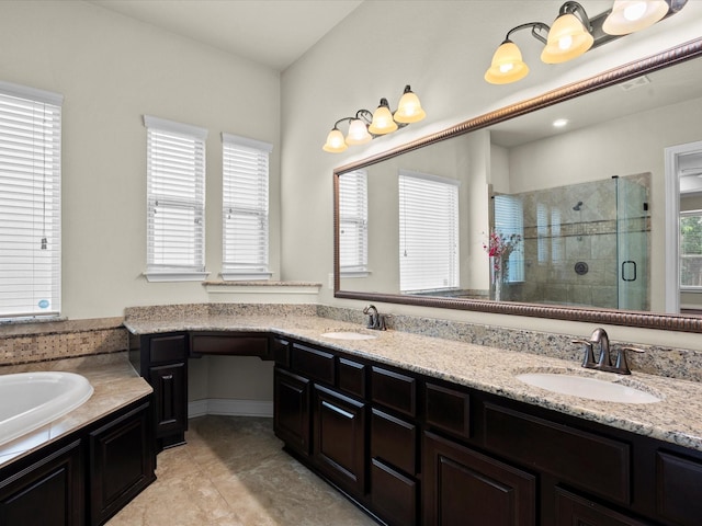 bathroom featuring double vanity, a sink, and a stall shower