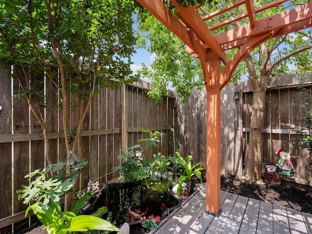 view of patio / terrace with a pergola, fence, and a wooden deck