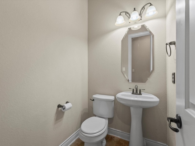 bathroom featuring toilet
