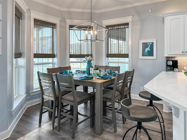dining area featuring crown molding, dark wood-style floors, a notable chandelier, and plenty of natural light