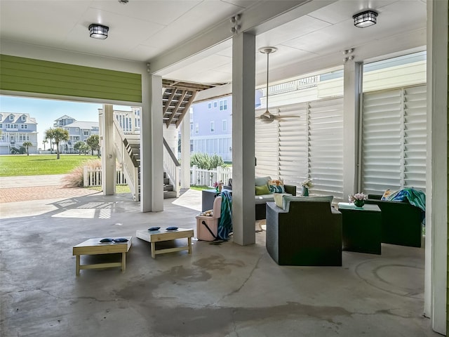 view of patio / terrace featuring an outdoor living space and stairway