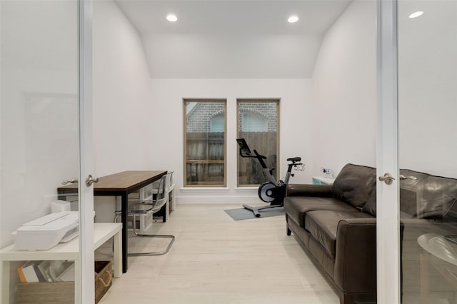 interior space with lofted ceiling, french doors, light wood-type flooring, and recessed lighting