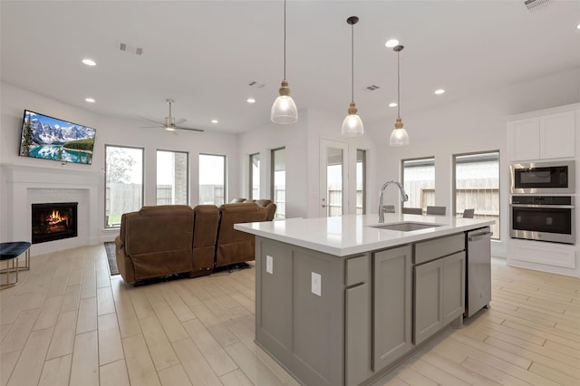 kitchen with plenty of natural light, a sink, stainless steel appliances, and visible vents