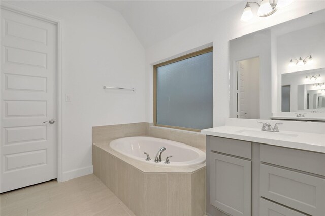 20514 Yearling Pasture Ln, Tomball, TX 77377 - full bath featuring vanity, a bath, vaulted ceiling, and tile patterned floors