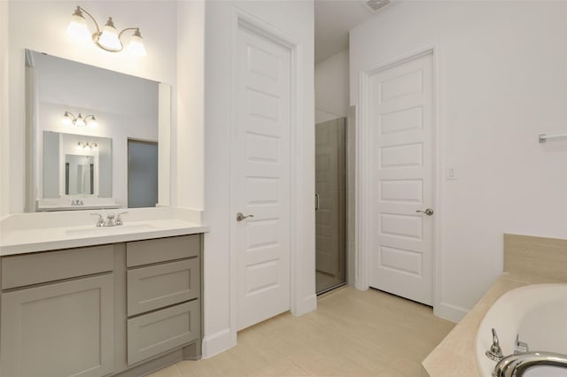 20514 Yearling Pasture Ln, Tomball, TX 77377 - bathroom featuring vanity, a garden tub, and tiled shower