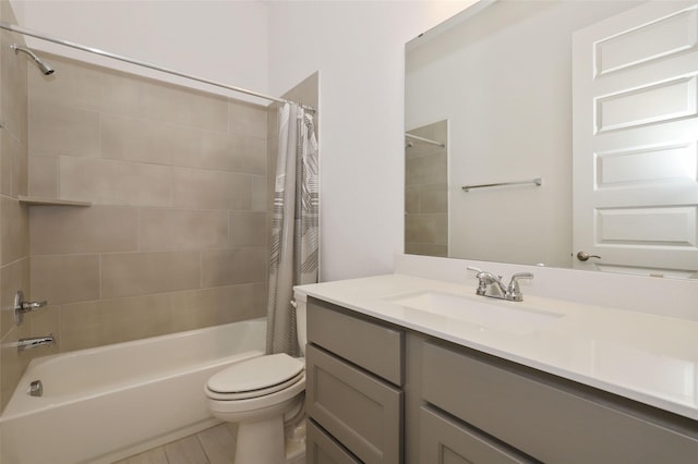 full bath featuring shower / bathtub combination with curtain, vanity, and toilet