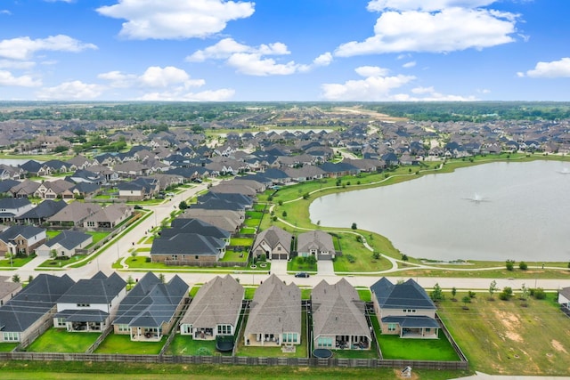 birds eye view of property featuring a water view and a residential view