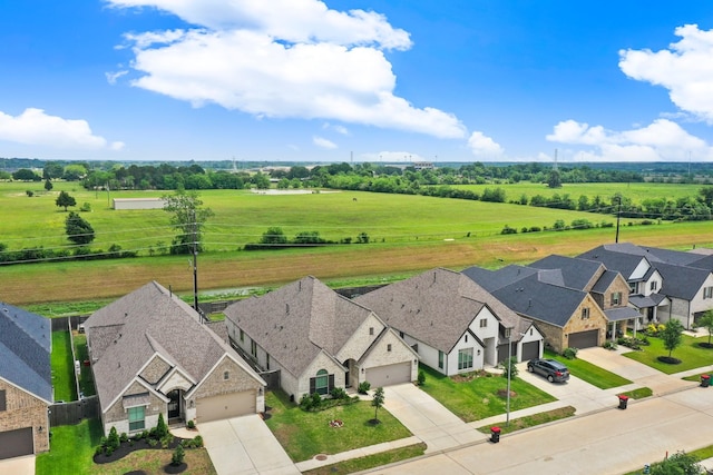 birds eye view of property featuring a rural view and a residential view