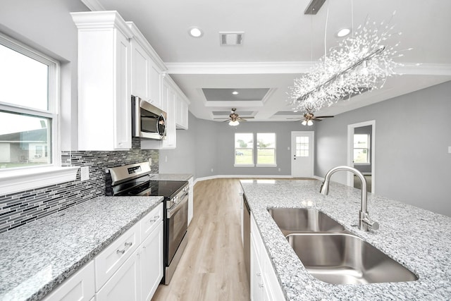 3527 Brook Valley Dr, Brookshire, TX 77423 - kitchen featuring stainless steel appliances, a sink, tasteful backsplash, light wood-style floors, and coffered ceiling