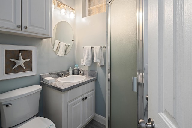 19427 Shores Dr, Galveston, TX 77554 - bathroom with a shower stall, toilet, and vanity