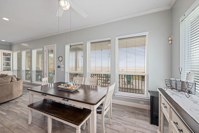 19427 Shores Dr, Galveston, TX 77554 - dining area with a wealth of natural light, ornamental molding, and light wood finished floors
