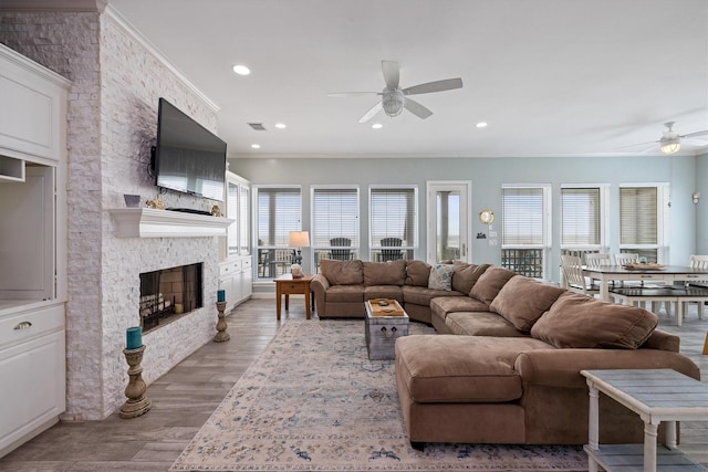 19427 Shores Dr, Galveston, TX 77554 - living room featuring recessed lighting, a ceiling fan, wood finished floors, and a fireplace