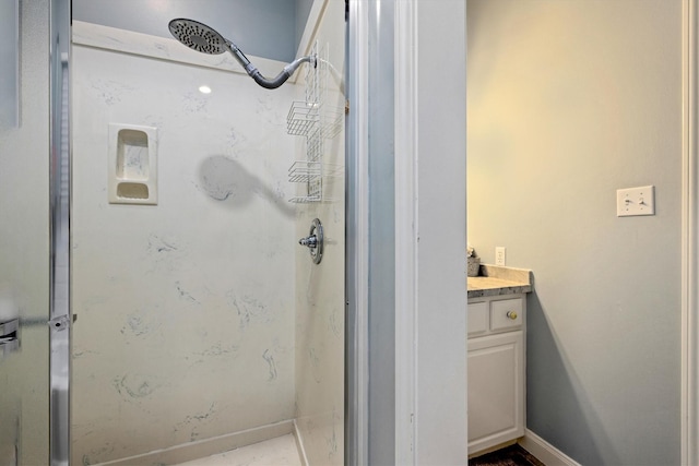 19427 Shores Dr, Galveston, TX 77554 - full bathroom featuring vanity, a stall shower, and baseboards