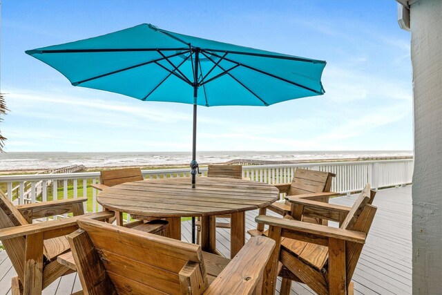 19427 Shores Dr, Galveston, TX 77554 - wooden terrace with a view of the beach, outdoor dining area, and a water view