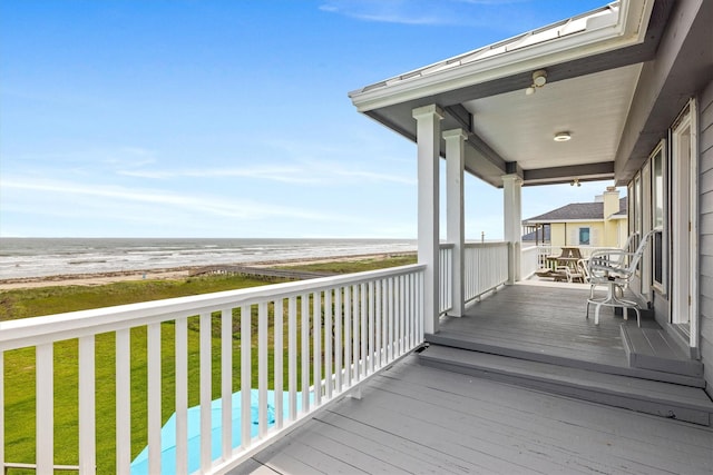 19427 Shores Dr, Galveston, TX 77554 - wooden terrace with a yard and a water view
