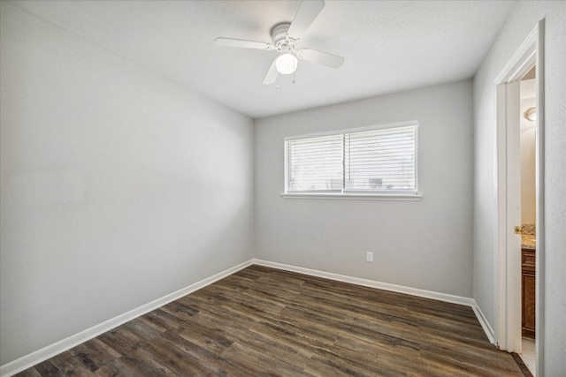 3206 Crossfell Rd, Spring, TX 77388 - unfurnished bedroom featuring dark wood finished floors, baseboards, and ceiling fan
