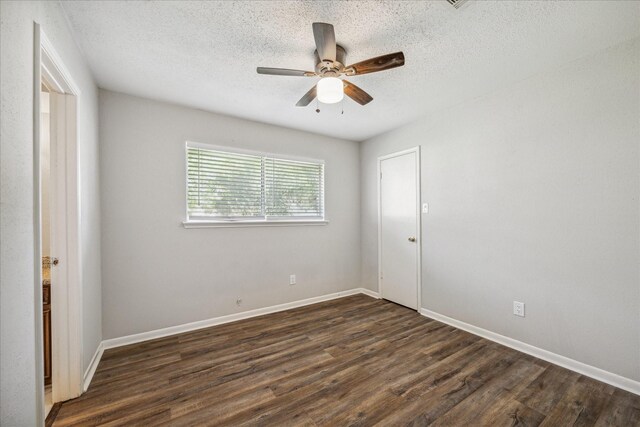 3206 Crossfell Rd, Spring, TX 77388 - spare room featuring ceiling fan, dark wood-style flooring, a textured ceiling, and baseboards