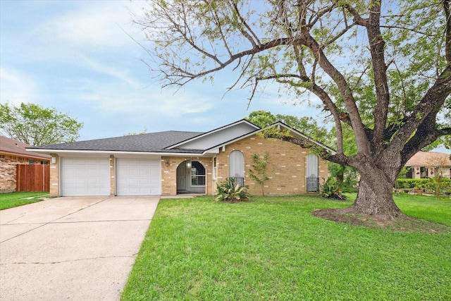 3206 Crossfell Rd, Spring, TX 77388 - ranch-style house with brick siding, a garage, driveway, and roof with shingles