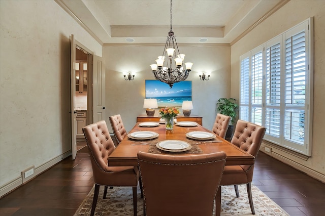 46 Chestnut Meadow Dr, Conroe, TX 77384 - dining space featuring a chandelier, a tray ceiling, dark wood-style flooring, baseboards, and crown molding