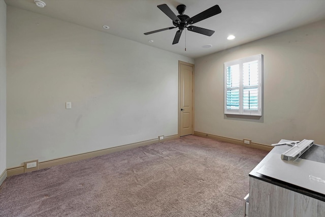 empty room featuring recessed lighting, baseboards, light carpet, and a ceiling fan
