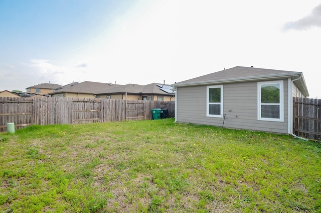 view of yard with a fenced backyard