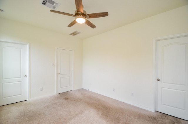 unfurnished bedroom featuring visible vents, ceiling fan, carpet floors, and baseboards