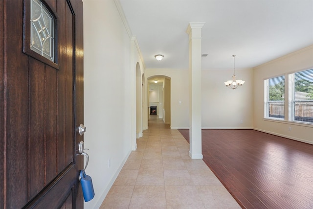 3635 Sunlight Hill Ln, Spring, TX 77386 - foyer entrance featuring a chandelier, baseboards, ornamental molding, and arched walkways
