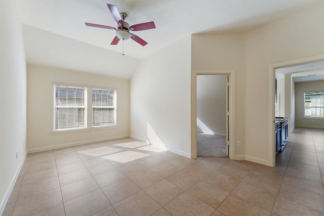 3635 Sunlight Hill Ln, Spring, TX 77386 - unfurnished room featuring light tile patterned floors, a ceiling fan, vaulted ceiling, and baseboards
