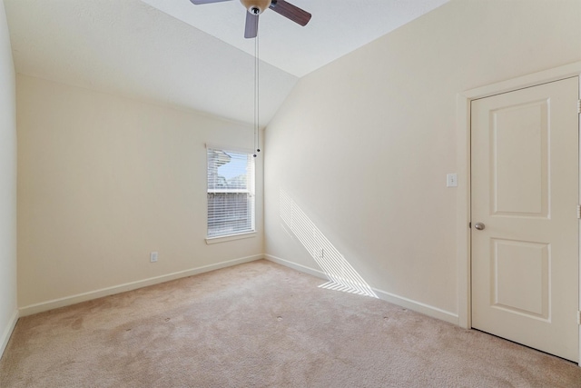 3635 Sunlight Hill Ln, Spring, TX 77386 - empty room featuring a ceiling fan, vaulted ceiling, carpet, and baseboards