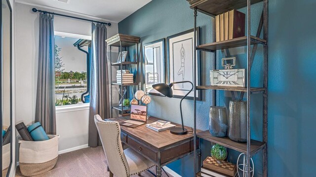 home office with carpet floors and baseboards