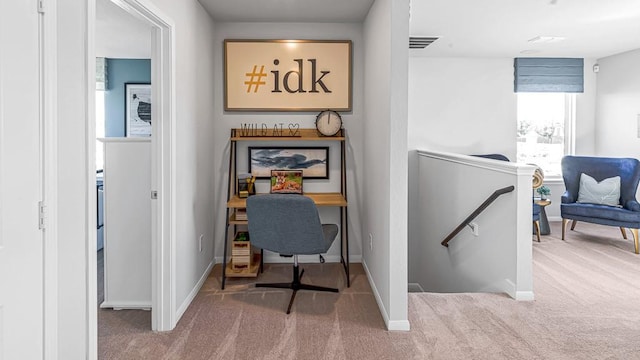 carpeted office featuring visible vents and baseboards