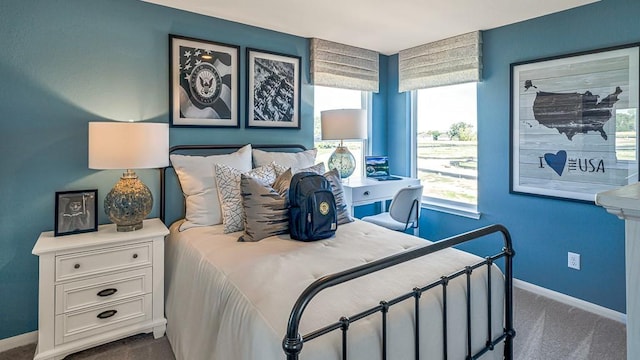 carpeted bedroom with baseboards