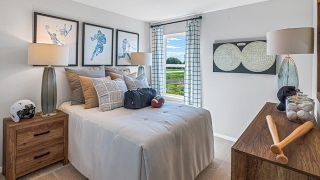 bedroom with carpet and baseboards