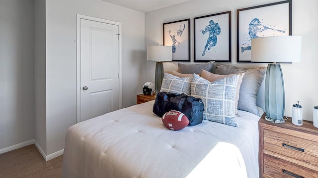 carpeted bedroom featuring baseboards