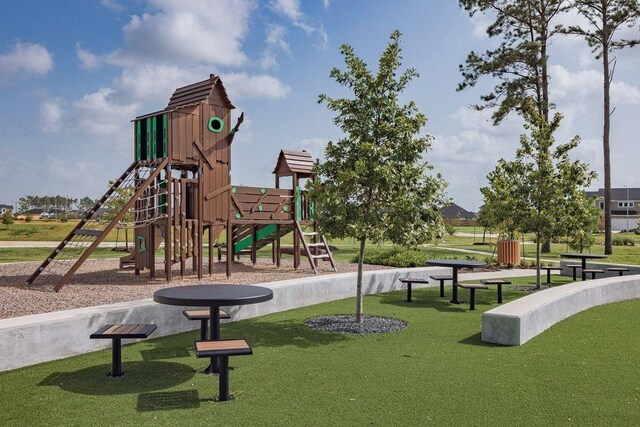 community play area featuring a lawn