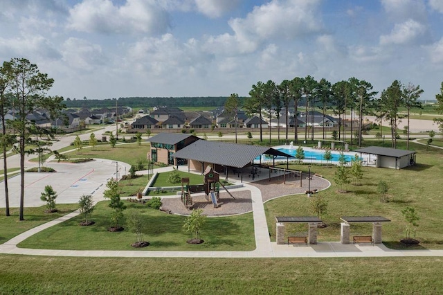 view of home's community featuring a lawn and a residential view