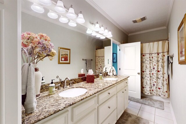 13671 Suzanne Pl, College Station, TX 77845 - bathroom featuring double vanity, visible vents, tile patterned flooring, and a sink