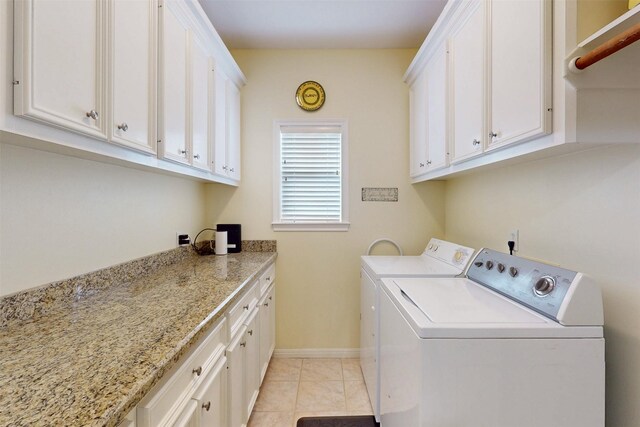 13671 Suzanne Pl, College Station, TX 77845 - laundry area with light tile patterned floors, washer and dryer, cabinet space, and baseboards