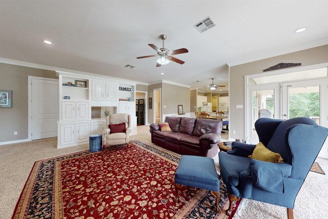 13671 Suzanne Pl, College Station, TX 77845 - living room featuring visible vents, a ceiling fan, crown molding, and light colored carpet